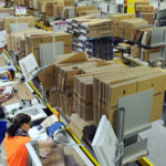 People working at an amazon warehouse.
