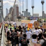 1,000 essential immigrant workers and allies take over the Manhattan Bridge calling on Citizenship for all!
