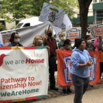 Members and allies rally outside Schumer's home calling for a pathway to citizenship.